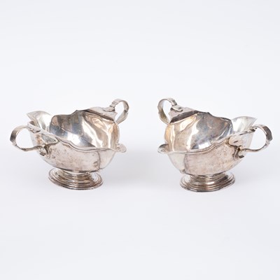 Lot 12 - A pair of George III double-lipped silver sauce boats