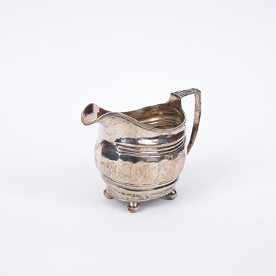 Lot 13 - A George III silver cream jug