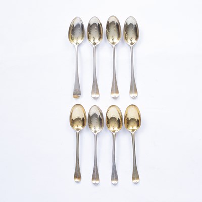 Lot 18 - Seven George I Britannia standard silver gilt rattail pattern dessert spoons