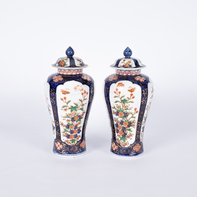 Lot 203 - A pair of Japanese Imari lidded vases