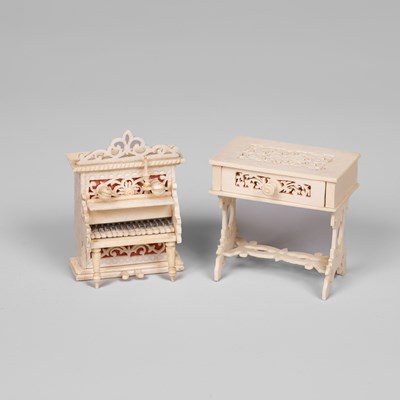 Lot 460 - A small scale German bone dolls' house upright piano and a work table