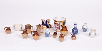 Lot 483 - A group of dolls' house ceramics