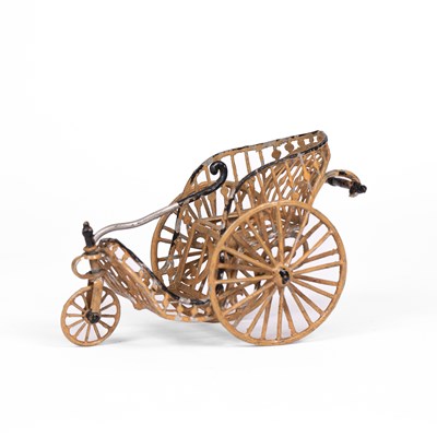 Lot 494 - A rare German soft metal dolls' house invalid carriage