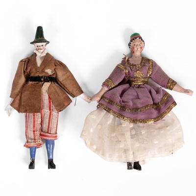 Lot 516 - A pair of unusual 'alien head' German dolls' house dolls