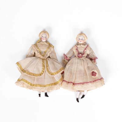 Lot 529 - A pair of German bisque dolls’ house dolls