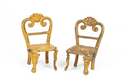 Lot 598 - A pair of Evans & Cartwright dolls' house chairs