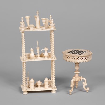 Lot 583 - A German bone dolls' house whatnot and a chess table
