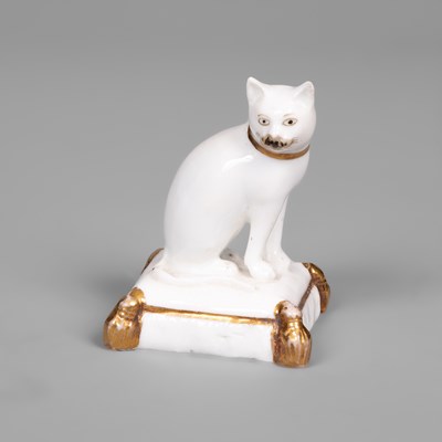 Lot 611 - A rare Rockingham porcelain miniature model of a cat
