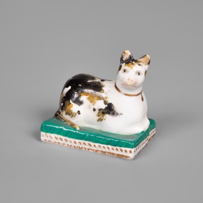 Lot 614 - A Derby porcelain miniature model of a cat