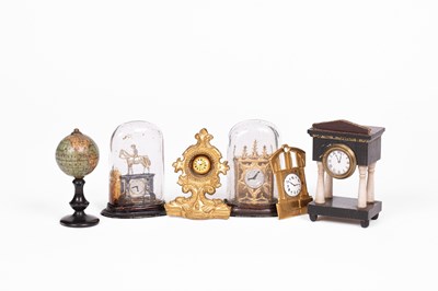 Lot 620 - Six German dolls' house clocks and a Walterhausen globe