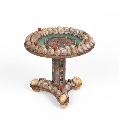 Lot 627 - An unusual novelty miniature dolls' house shellwork table