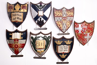 Lot 4 - A collection of painted plaster school and university heraldic shields