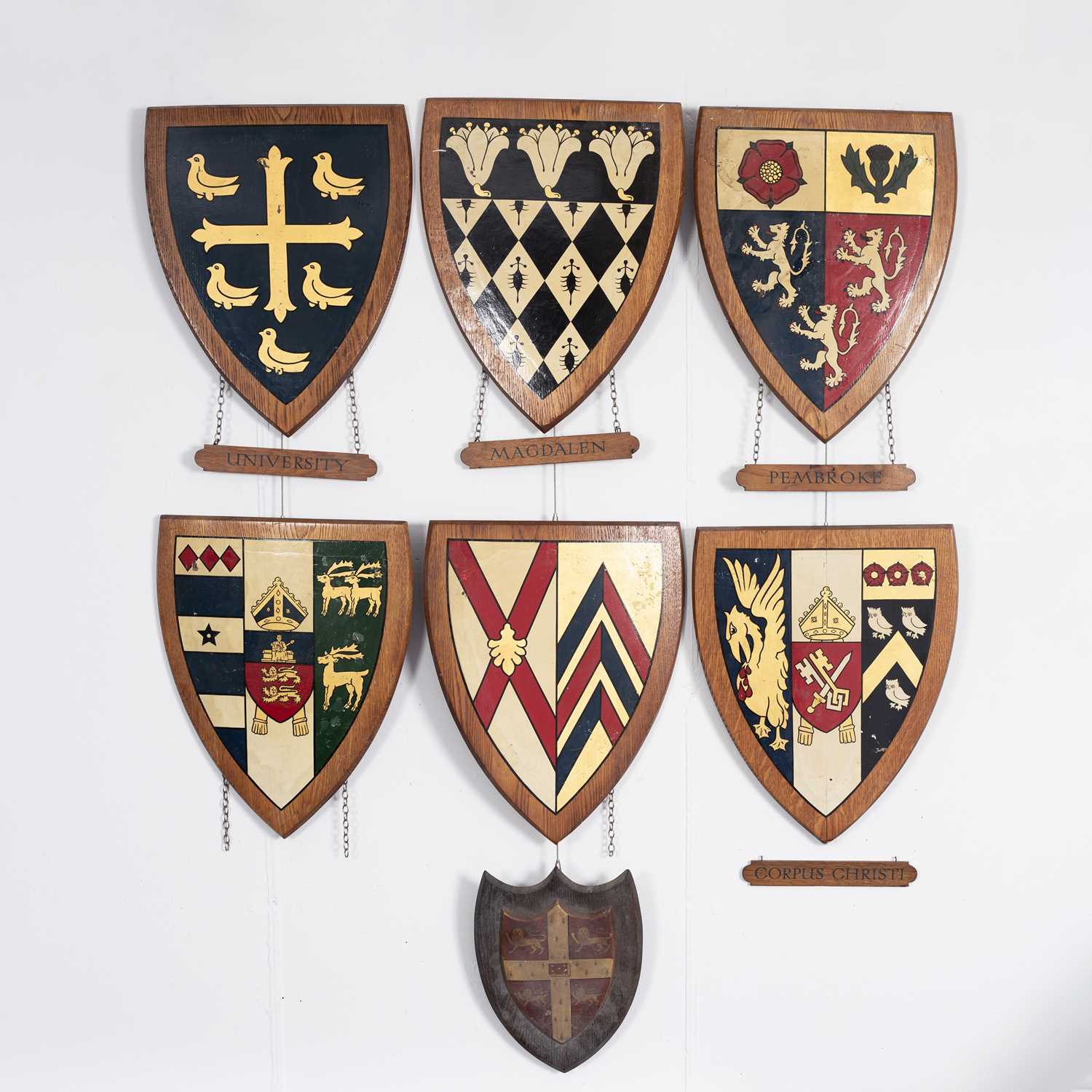 Lot 6 - A collection of wood framed and painted University and School heraldic shields