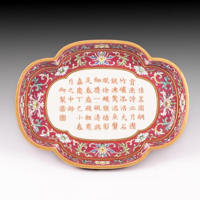 Lot 212 - A Chinese famille rose ruby ground imperially inscribed quadrilobed tray