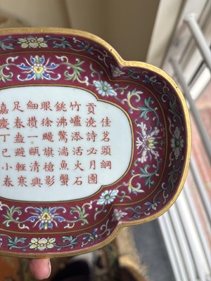 Lot 212 - A Chinese famille rose ruby ground imperially inscribed quadrilobed tray