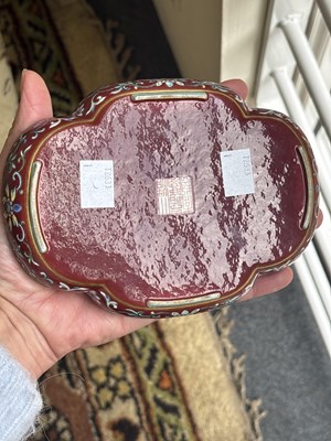 Lot 212 - A Chinese famille rose ruby ground imperially inscribed quadrilobed tray