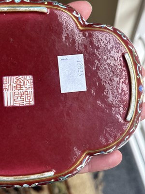 Lot 212 - A Chinese famille rose ruby ground imperially inscribed quadrilobed tray
