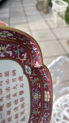 Lot 212 - A Chinese famille rose ruby ground imperially inscribed quadrilobed tray