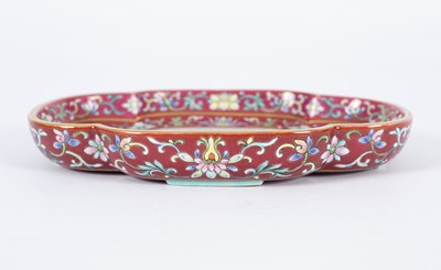 Lot 212 - A Chinese famille rose ruby ground imperially inscribed quadrilobed tray