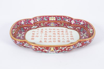 Lot 212 - A Chinese famille rose ruby ground imperially inscribed quadrilobed tray