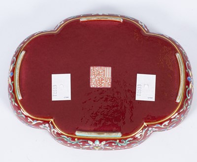 Lot 212 - A Chinese famille rose ruby ground imperially inscribed quadrilobed tray