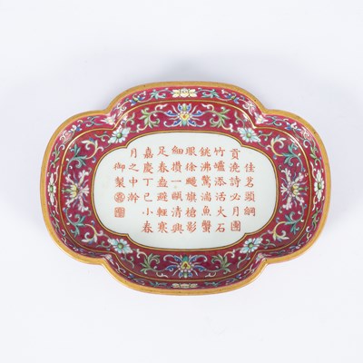 Lot 212 - A Chinese famille rose ruby ground imperially inscribed quadrilobed tray