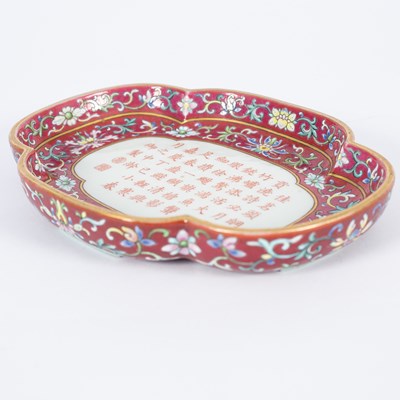 Lot 212 - A Chinese famille rose ruby ground imperially inscribed quadrilobed tray