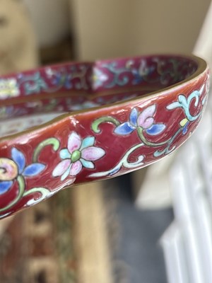 Lot 212 - A Chinese famille rose ruby ground imperially inscribed quadrilobed tray