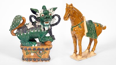 Lot 241 - A Chinese glazed pottery dog of fo