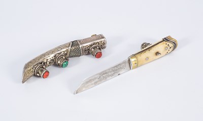 Lot 193 - A Tibetan white metal knife