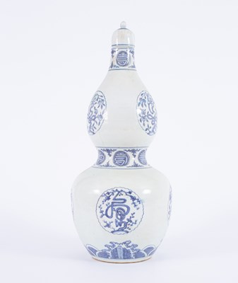 Lot 205 - A Chinese blue and white double gourd vase and cover