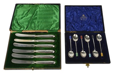Lot 580 - A set of six silver and enamel coffee spoons