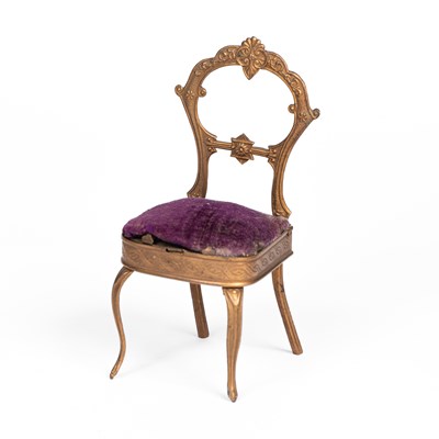 Lot 599 - A gilt metal Avery needlecase dolls' house chair