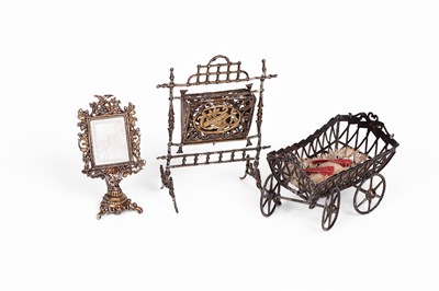 Lot 600 - Three German soft metal dolls' house pieces