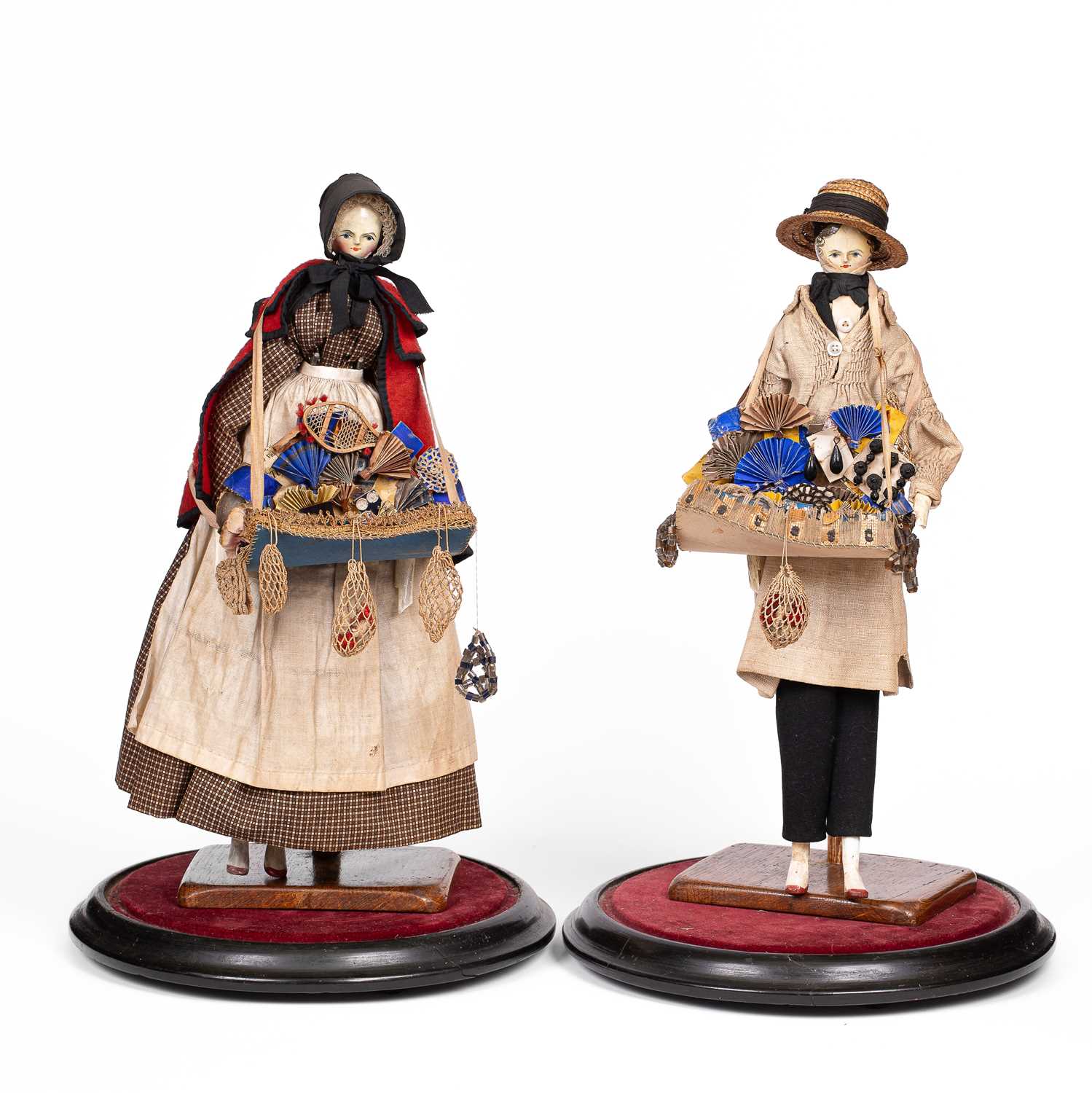 Lot A fine pair of large Grodnertal pedlar dolls
