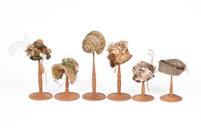 Lot 637 - A charming set of six elaborately-fashioned miniature hats