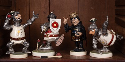 Lot 176 - A set of four 20th Century pottery satirical figures of cricketers in War of the Roses themed dress