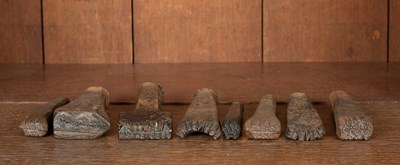 Lot 126 - A collection of eight early 20th Century cast iron cricket bat punches