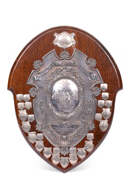 Lot 132 - A large silver mounted oak shield shaped cricket trophy plaque