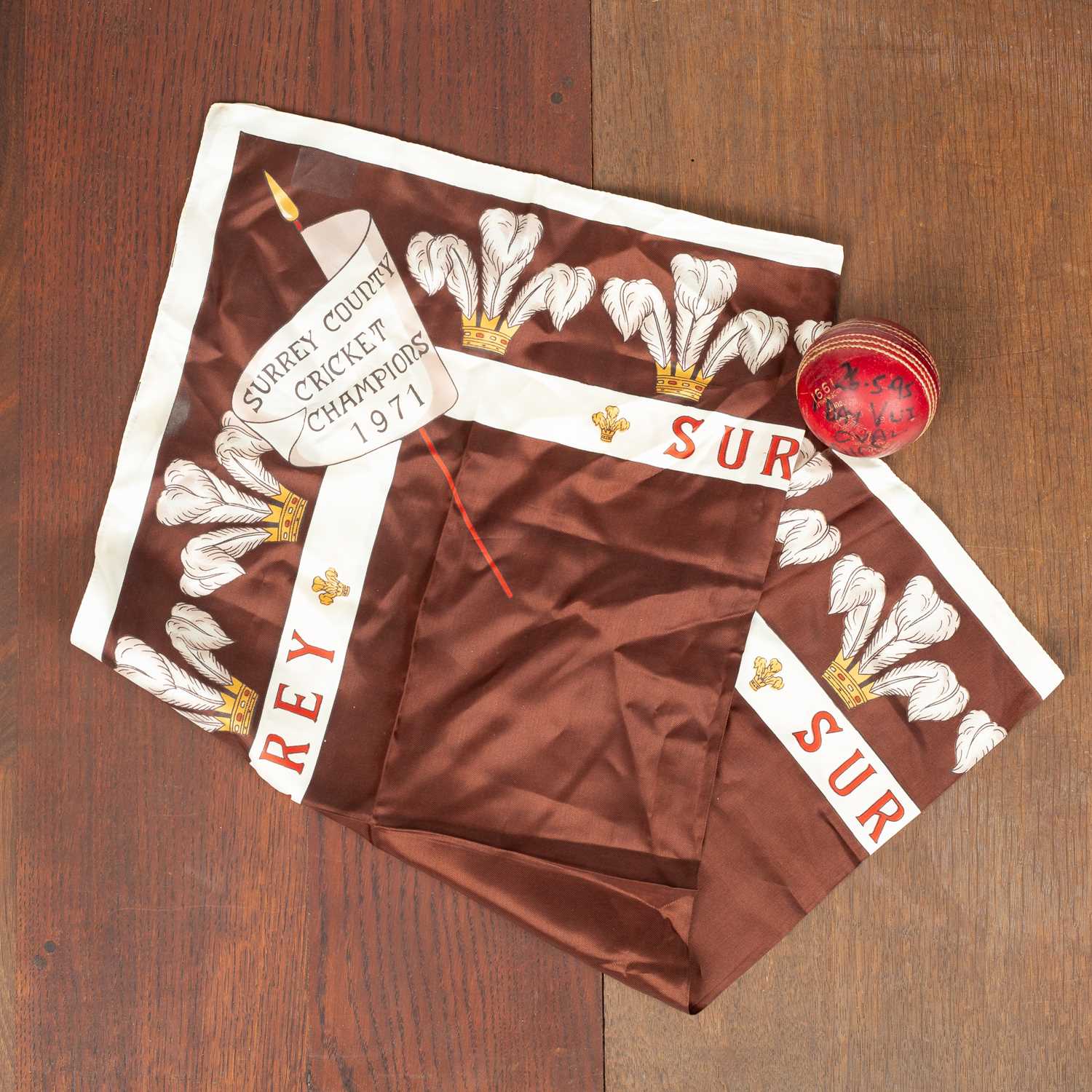 Lot 26 - A signed red Alfred Reader cricket ball