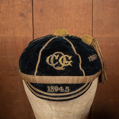 Lot 134 - A Victorian monogrammed black velvet cricket cap