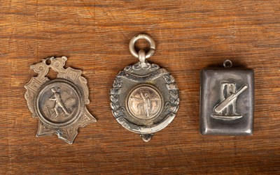 Lot 137 - Two Victorian silver cricket medals and a locket