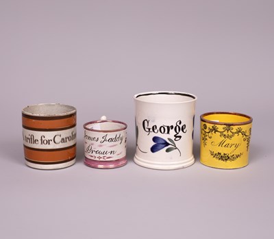 Lot 686 - Four 19th Century English earthenware named children's mugs