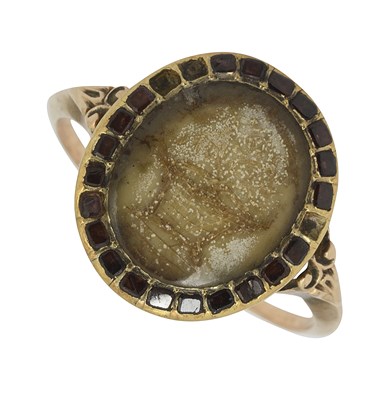 Lot 635 - A late 18th/early 19th Century yellow metal hairwork ring