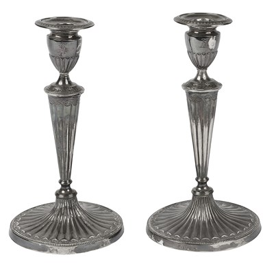 Lot 550 - A pair of George III silver candlesticks