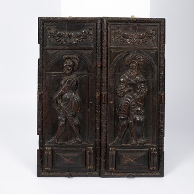 Lot 935 - A pair of Italian carved walnut cupboard doors
