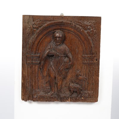 Lot 937 - A carved oak panel depicting John the Baptist