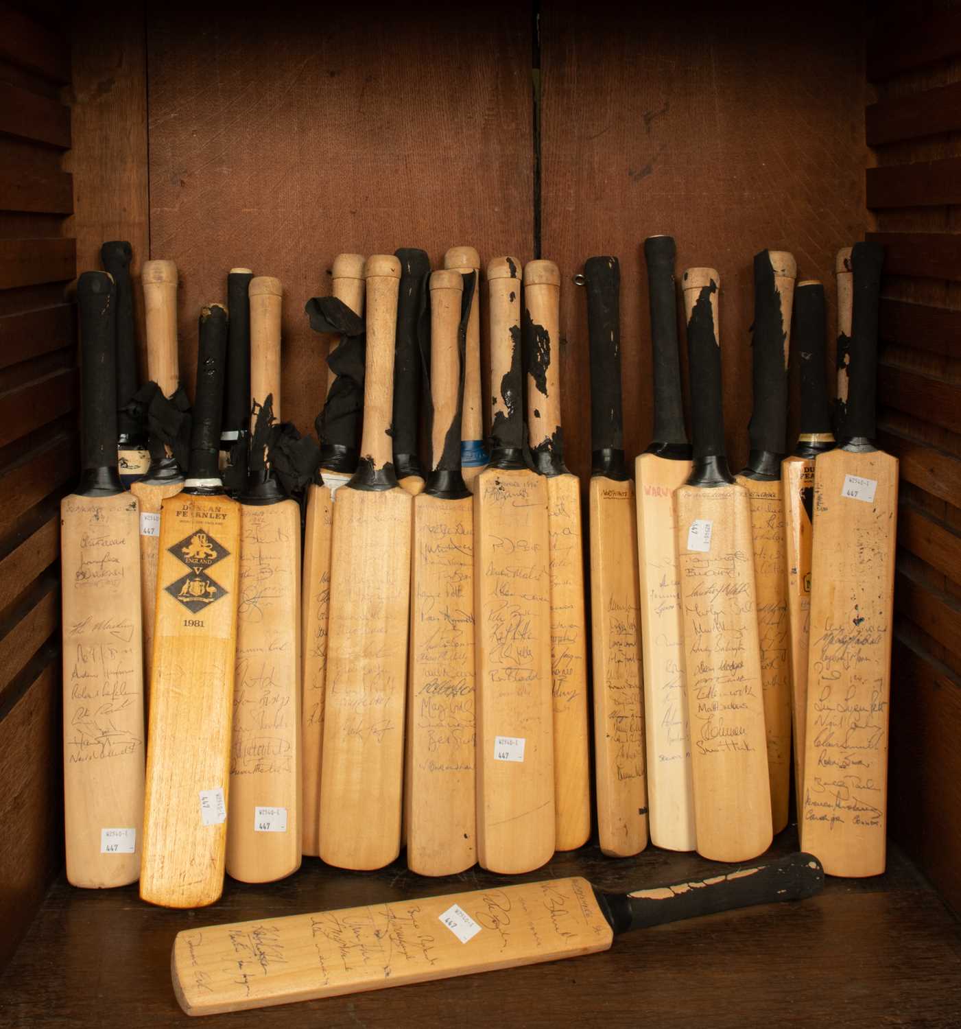 Lot 28 - A collection of twenty-one signed miniature commemorative cricket bats