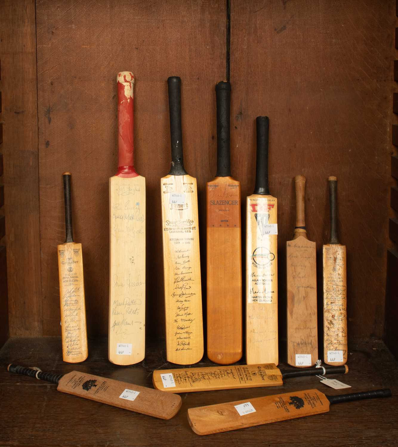 Lot 29 - A collection of commemorative miniature cricket bats
