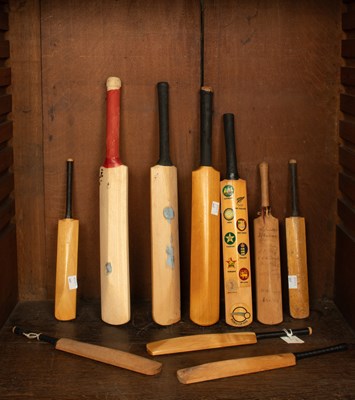 Lot 29 - A collection of commemorative miniature cricket bats